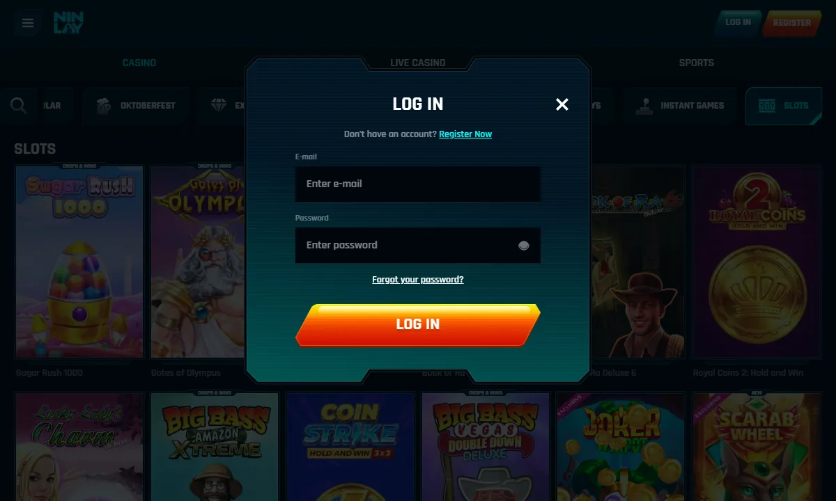 Leeres Log-in-Fenster von Ninlay Casino über der abgedunkelten Slots-Lobby, mit den Feldern E-mail und Password, dem Link Register Now und dem Knopf Log in