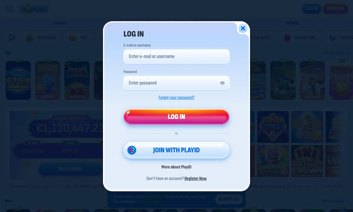 Leeres Log-in-Fenster von Nomini Casino mit Feldern für E-Mail oder Benutzername und Passwort, rotem Knopf Log in und darunter Join with PlayID